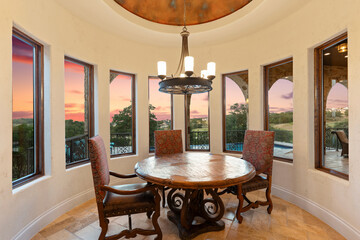 Cozy dining area with a stunning sunset view and elegant decor