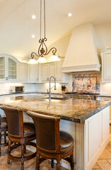 Elegant kitchen design featuring a spacious island and stylish decor