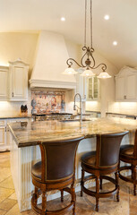 Elegant kitchen with marble countertop and vintage decor in warm lighting
