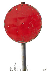 A closeup view of an aged, weathered red circular sign on a rusty metal post, set against an outdoor background. The sign bears signs of wear and tear, adding a rustic vintage charm