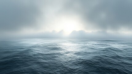Serene Ocean Landscape Under Misty Clouds and Soft Light Reflection
