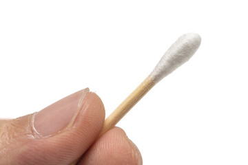 close up shot hand holding cotton bud. in white background.