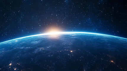 Obraz premium A stunning view of Earth from space, showcasing a glowing sunrise on the horizon against a backdrop of stars.