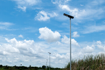 solar powered street light, Solar panels light pole on blue sky background, street light Solar panels pole.