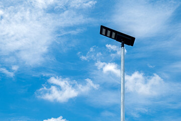 solar powered street light, Solar panels light pole on blue sky background, street light Solar...