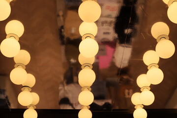 Bright lighting of buildings and structures close-up. Abstract drawings and backgrounds.