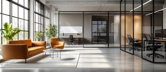 Modern office space with an orange sofa and a glass partition.