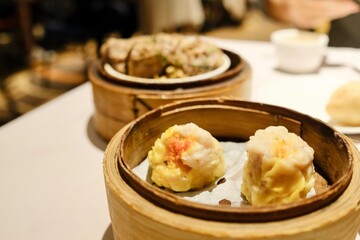 Close-up of bamboo steamers containing seafood siu mai and ngao yuk (beef meatballs) at The Eight, a yumcha restaurant at Sydney Chinatown - Haymarket, NSW, Australia