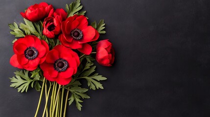 Fototapeta premium Vibrant red anemones bouquet close-up nature background for serene home decor