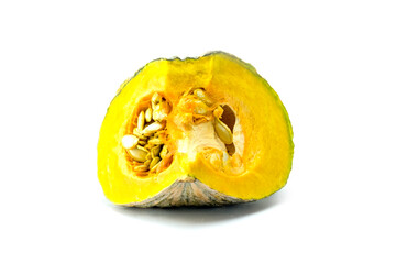 Sliced fresh pumpkin into piece and seeds isolated on white background stack close up, preparing for cooking 