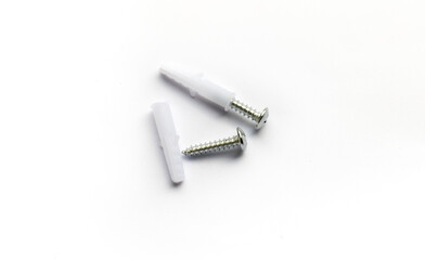 Anchor with screw, White anchor with screw on white background, plastic anchor with stainless screw on white background, construction tool.