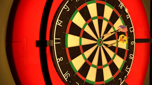 Two dart players aiming at the bulls eye. the one who is next start the game. Bullen