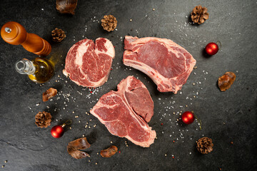 Raw t bone and rib eye steak with christmas deco