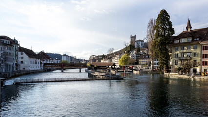 Cityscape of the Old Town (Altstadt) of Lucerne, Switzerland, along the Reuss River on a beautiful sunny spring day.