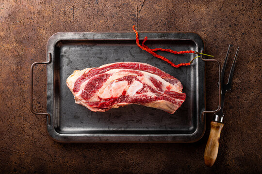 Fresh raw beef brisket, raw meat on the metall before cooking