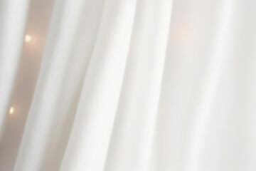 Obraz premium Soft white fabric drapes elegantly, creating serene and calming atmosphere. gentle texture and light play enhance peaceful ambiance of scene