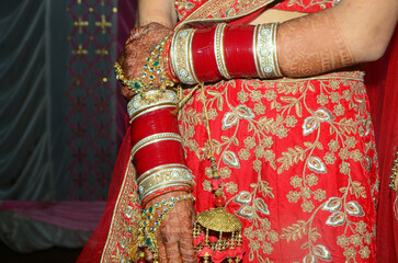 indian bride with red lehnga without face in marriage function