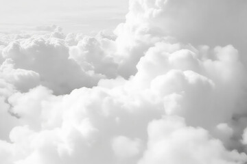 Fluffy white clouds fill sky, creating serene and peaceful atmosphere