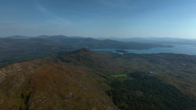 Sugarloaf, Caha Mountains, County Cork, Ireland, September 2024. Drone tracks left above the craggy peaks with the North Atlantic Ocean to the south and Glengarriff in the distance.