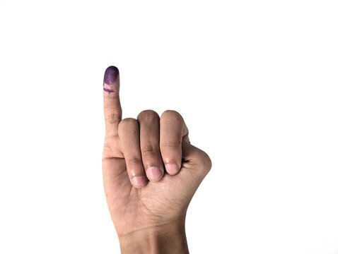 A man's little finger with blue ink stains, isolated against a white background. The blue ink marks are from voting in Indonesia's election.
