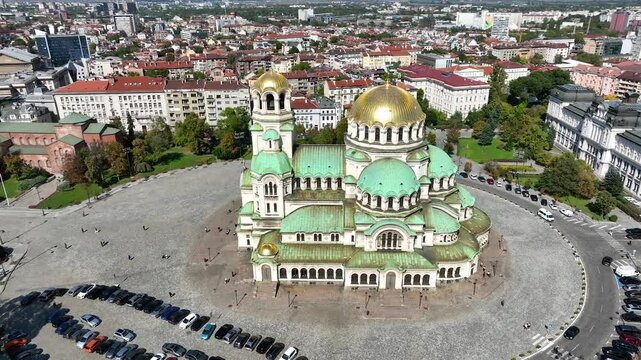 4K Aerial view of capital of Bulgaria, Sofia.Iconic building. View to cathedral St. Alexander Nevsky, the largest church in the Balkans. Lateral movement. Roofs of buildings, streets and park in Sofia