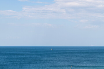 Obraz premium boat on the deep blue sea