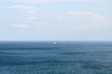 Fototapeta premium boat on the deep blue sea