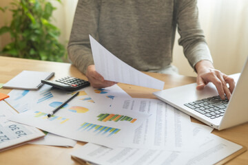 Accountant Analyzing Business Charts And Financial Reports To Illustrate Stock Market Growth And Marketing Strategies In Professional Office Or Home Work Environments.