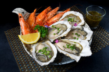 Fresh opened oysters and shripms