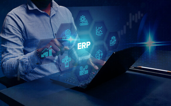 ERP Cloud Software Automation: A businessman analyzing Enterprise Resource Planning (ERP) applications, including inventory, finance, HR, supply chain, and CRM, on a virtual screen using his laptop.