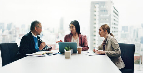 Japan, laptop and business people in meeting, conversation and discussion with review. Employees, global traders and group in office, computer and feedback for progress, idea and communication