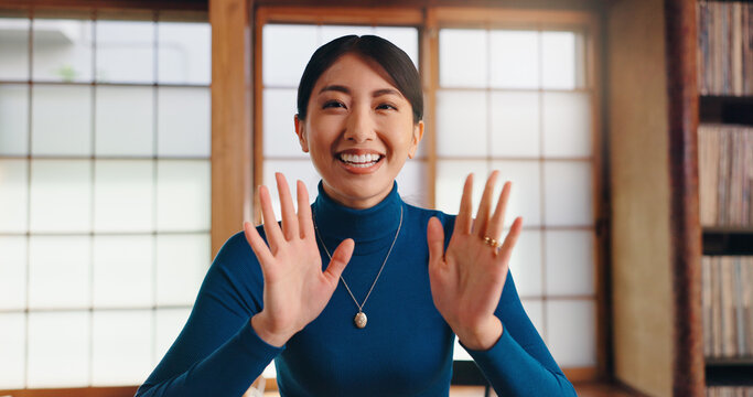 Japan, house and woman with video call, portrait and greeting with hello, waving and happiness. Asian girl, apartment or person in lounge, smile or communication with linguist, pov or virtual meeting