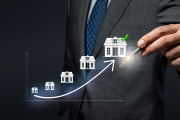 Franchise concept. Expansion Strategy Visualization and Franchise Business Growth. Entrepreneur visualizing franchise growth trajectory with increasing store icons on a digital upward trend graph.