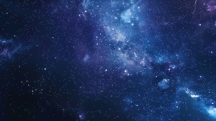 Fototapeta premium A dark, starry night sky with a nebula.
