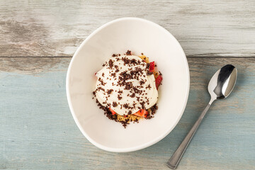 Top view of Strawberry magnolia dessert in white porcelain bowl