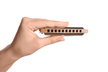 Female hand with harmonica on white background, closeup