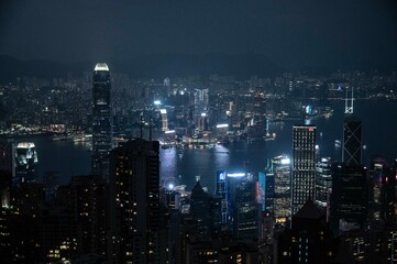 Naklejka premium Hong Kong, Hong Kong, China - 11.17.2024 - night view over Hong Kong harbour from the Peak