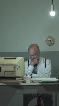 Bored office clerk staring at the computer screen