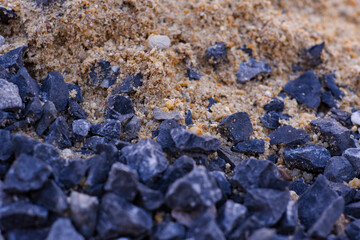 Soil, rocks, sand, damaged asphalt roads