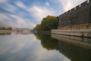 Fototapeta premium Beautiful scenery of the ancient city wall ruins and moat and bridge in Suzhou, Jiangsu Province, China