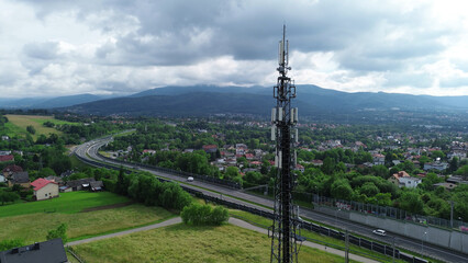 Telecommunications tower and town landscape in mountains