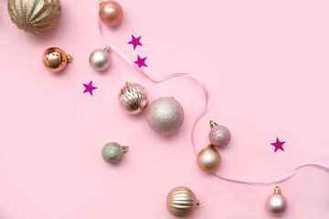 Beautiful composition with Christmas balls, confetti and ribbon on pink background