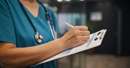 Hands, person and nurse writing on clipboard at clinic for medical referral, diagnosis report and...