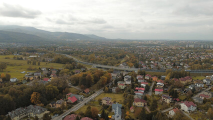 Small town nestled in hilly forest landscape