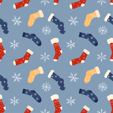 Seamless pattern with Christmas socks and snowflakes. Various winter colorful socks with different patterns. Cotton and wool accessories. Vector flat pattern.