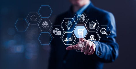 Businessman Pointing at Quality Control Icons for Systematic Management Standards