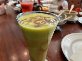 Delicious Green Smoothie with Chocolate Drizzle at a Restaurant