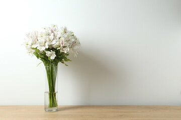 Beautiful white alstroemeria 
in a vase on the table