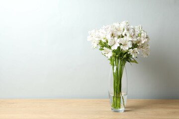 Beautiful white alstroemeria 
in a vase on the table