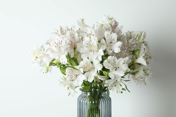 Beautiful white alstroemeria 
in a vase on the table